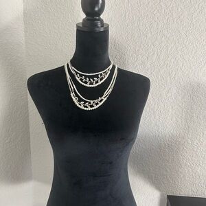 Two necklaces:White Multi-Layers with Pearl Accents.